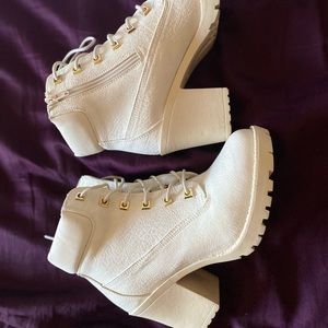 Multiple pairs of woman’s shoes.